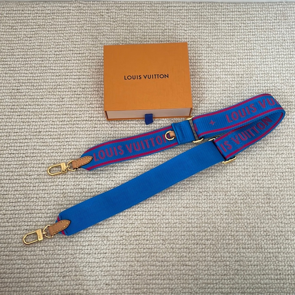 Louis Vuitton blue bandolier strap. Like new with box and dust bag.